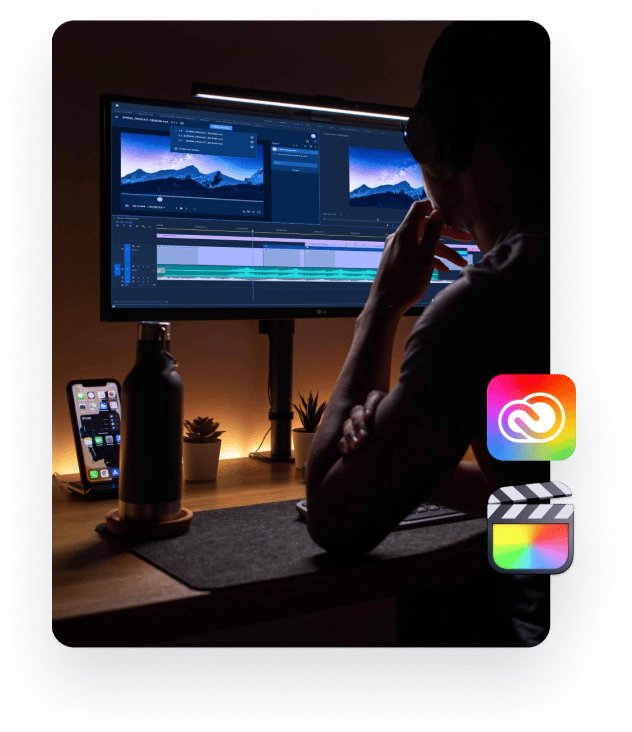 Connect and extend your video workflow capabilities - man sitting by his modern pc setup reviewing video content - for video production-1