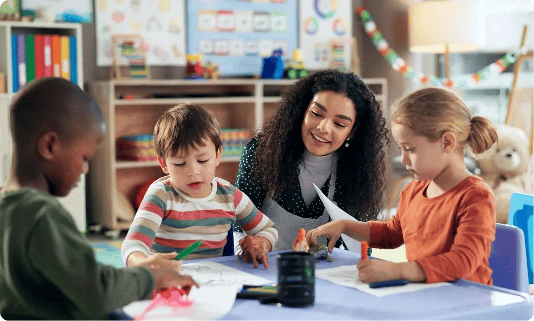 Teacher working with children during a classroom activity at Bright Horizons
