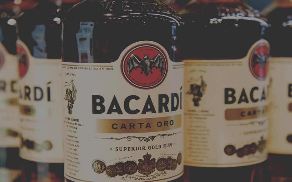 Bacardi Carta Oro Superior Gold rum bottles in bulk with labels